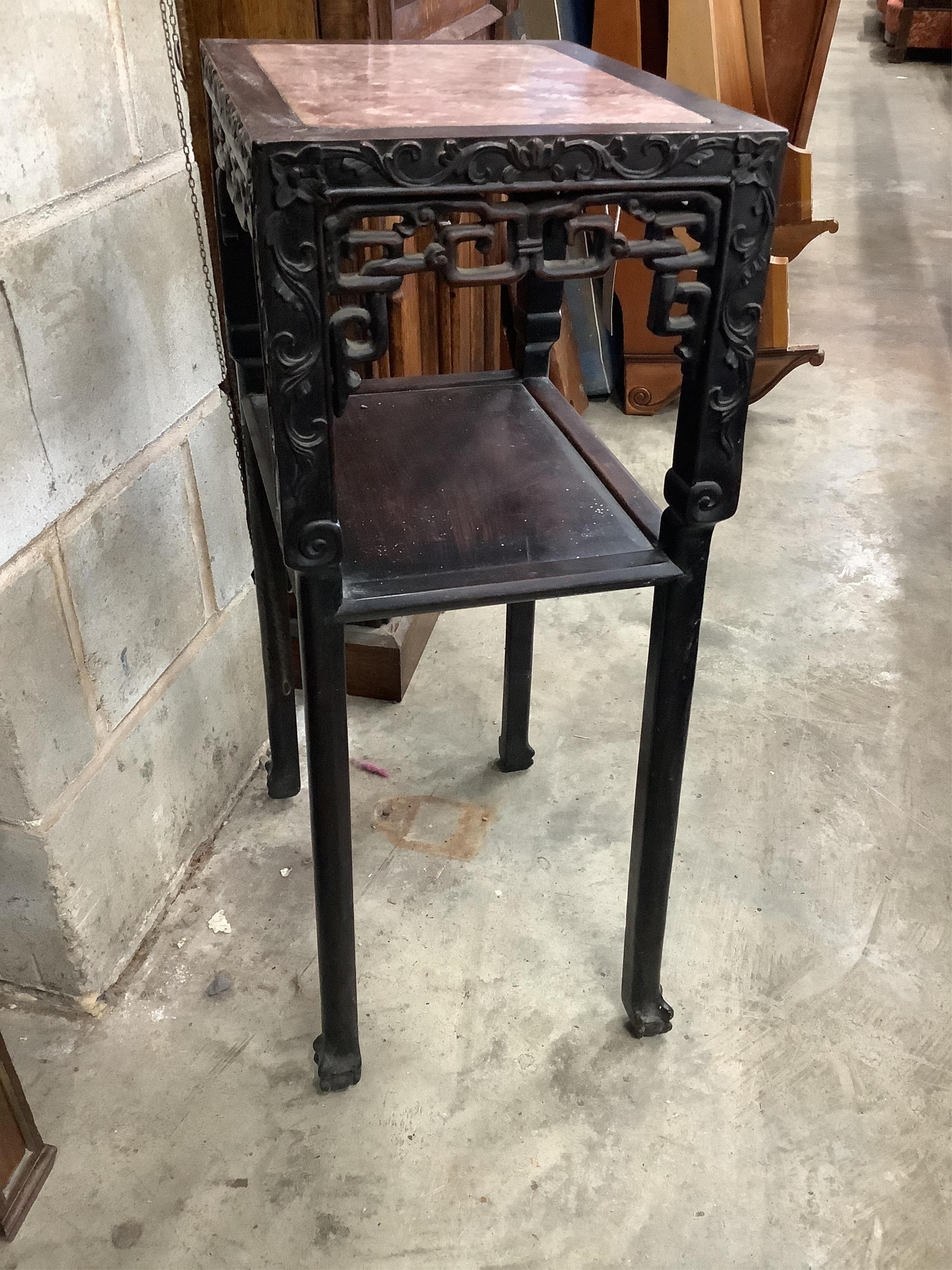 A Chinese carved hardwood urn stand, width 42cm, depth 32cm, height 81cm. Condition - fair